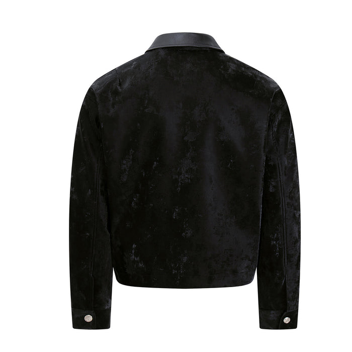 Back view of a black velvet Detroit jacket with leather collar, long sleeves, and buttoned cuffs
