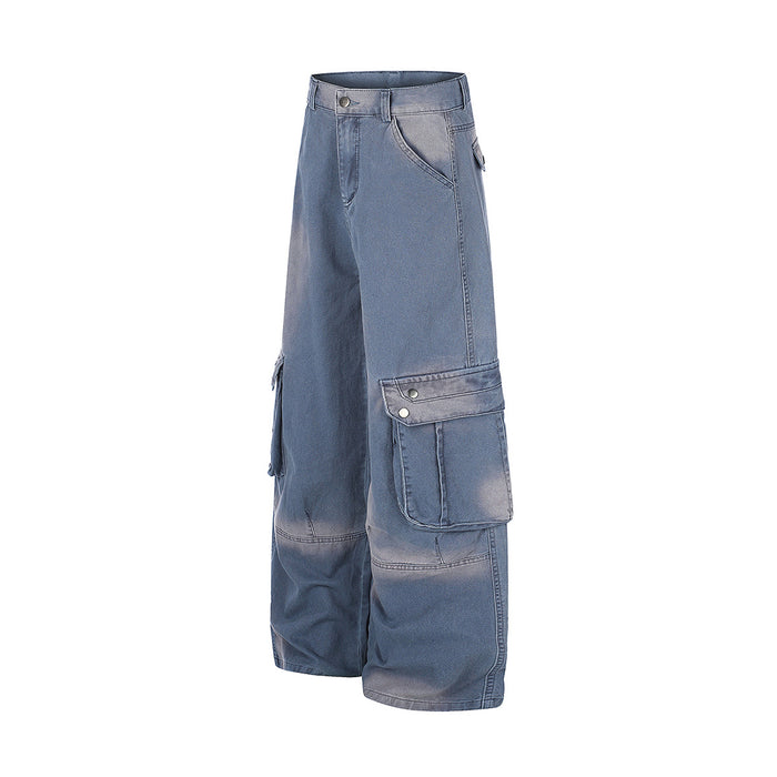 Side view of washed blue wide-leg cargo jeans highlighting the large flap cargo pocket and relaxed leg