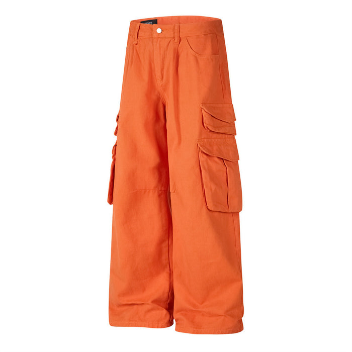 Angled front view of orange wide-leg cargo pants with layered side cargo pockets and a relaxed fit