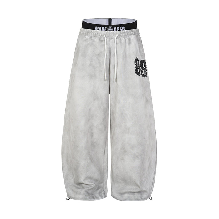 Acid wash wide-leg sweatpants in light grey with double waistband and distressed 98 graphic, front view