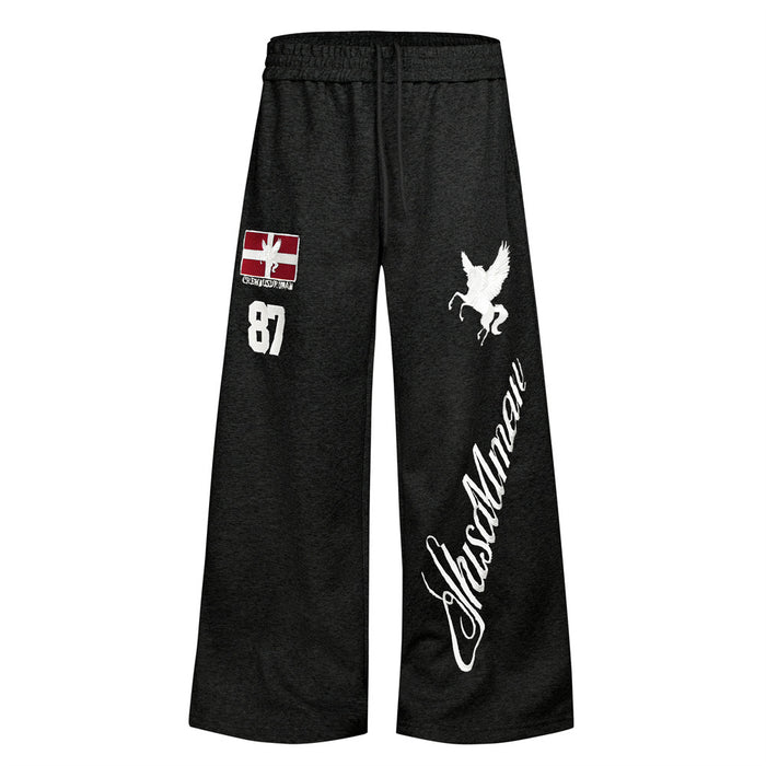 Black wide-leg sweatpants front view with elastic waistband, red letter patch, white Pegasus and script leg graphic