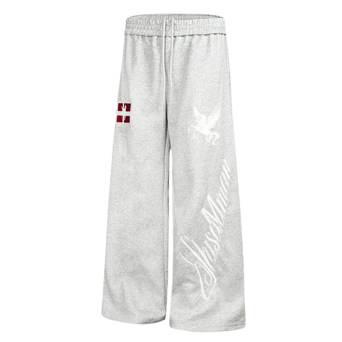Gray wide-leg sweatpants angled front view highlighting the white Pegasus and diagonal script leg graphic
