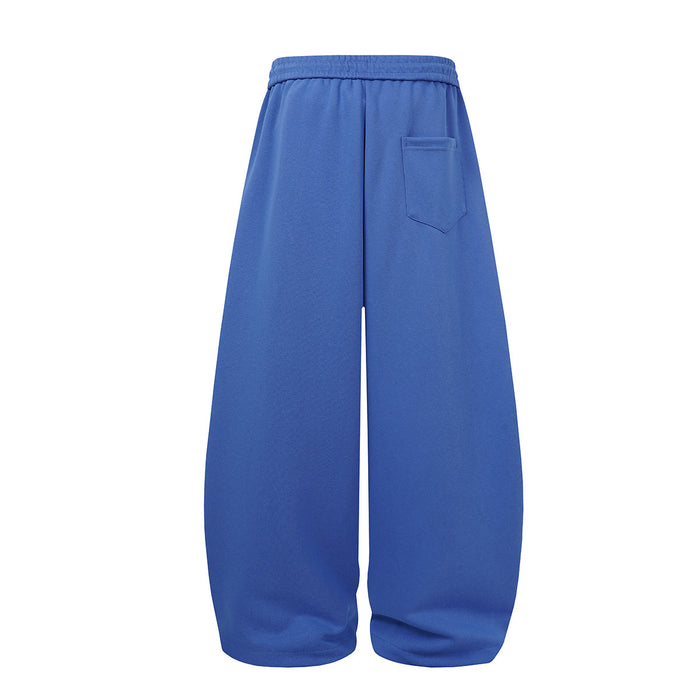 Blue wide-leg sweatpants shown from the back with an elastic waistband and single rear patch pocket