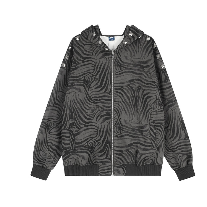 Dark grey all-over zebra stripe print zip-up hoodie jacket with silver pyramid rivet studs along the shoulder seam, front and